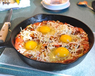 Refried Bean Sauce with Eggs on Top ♥ KitchenParade.com, a hearty protein-packed weekend brunch recipe.
