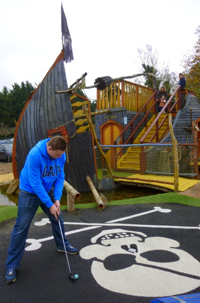 Minigolf Champion Matt Dodd putting during the Surrey Invitational Tournament round at Pirate Island Adventure Golf at Hoebridge Golf Centre in Woking Minigolf Champion Matt Dodd putting during the Surrey Invitational Tournament round at Pirate Island Adventure Golf at Hoebridge Golf Centre in Woking