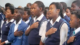 Students from a township of Cape Town in South Africa sing the National Anthem of South Africa