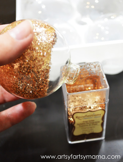 DIY Glitter Ornaments at artsyfartsymama.com #glitteratmichaels #Christmas