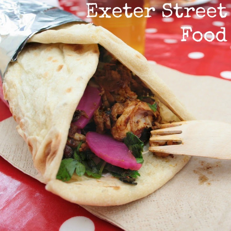 If you're in Exeter and hungry, Exeter Street Food is the place to go!  Situated in the Guildhall Shopping Centre with the 12th century St Pancras church it offers food stands that represent all types of cuisine made from local produce as well as a 