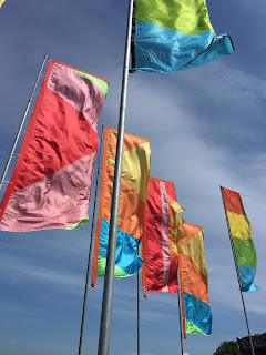 Flags against blue sky