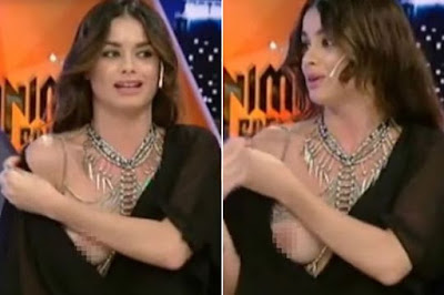 Model Suffers Embarrassing Wardrobe Malfunction After Pulling Top