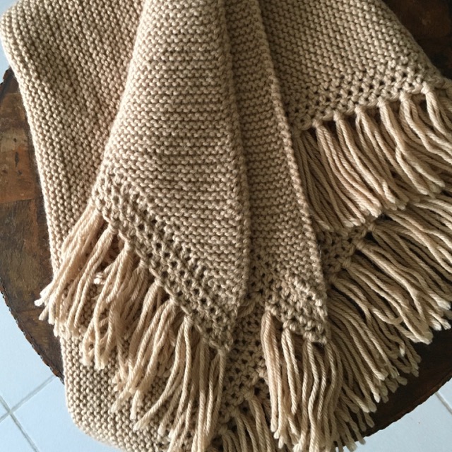 Beige knitted shawl