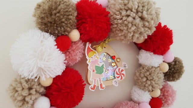 tutorial corona de navidad de pompones