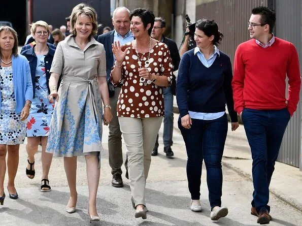 Queen Mathilde visited a farm breeds cattle, grows crops and strawberries and focuses on green care. beige cotton midi shirt dress embroidered