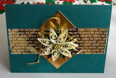 green christmas card with ivory quilled detachable poinsettia tree ornament