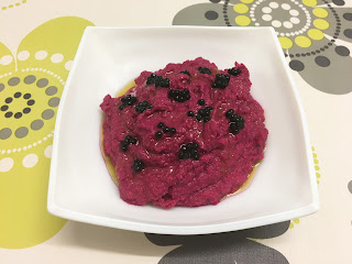 Beet hummus with black truffle pearls