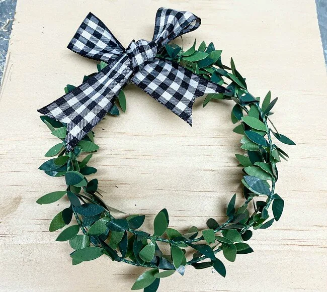 Wreath with black and white checked bow