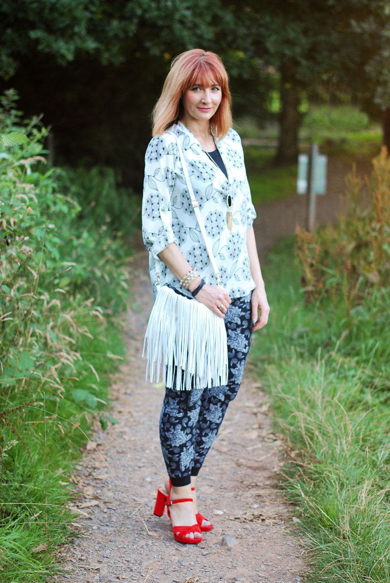 Black and white pattern mixing for summer: Dandelion flower print and paisley, red strappy sandals, fringed bag | Not Dressed As Lamb