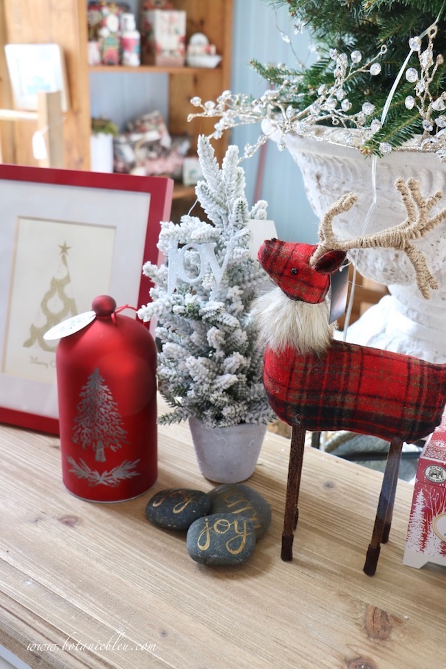 French Country Christmas Event 2019 has a red plaid deer with a fur collar