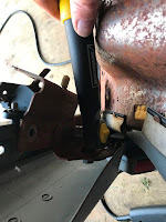 Remove the seat adjustment bracket with the socket wrench 
