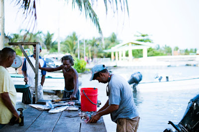 Remax Vip Belize: Cleaning the fish!