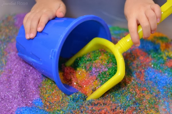Amazingly fun ways to play with sand including recipes for aqua sand, magic sand, sand slime, sand paint, homemade colored sand, and how to make a sand volcano