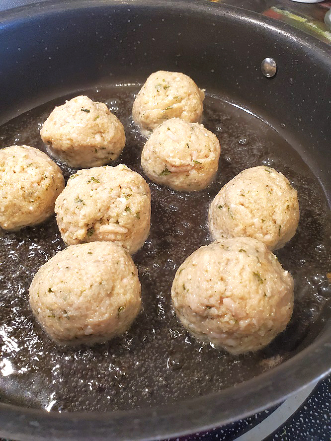 this are chicken meatballs frying in oil