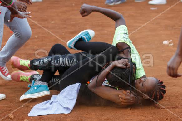 Two Women Fight Over A Man During A Football Match In Kenya Photo