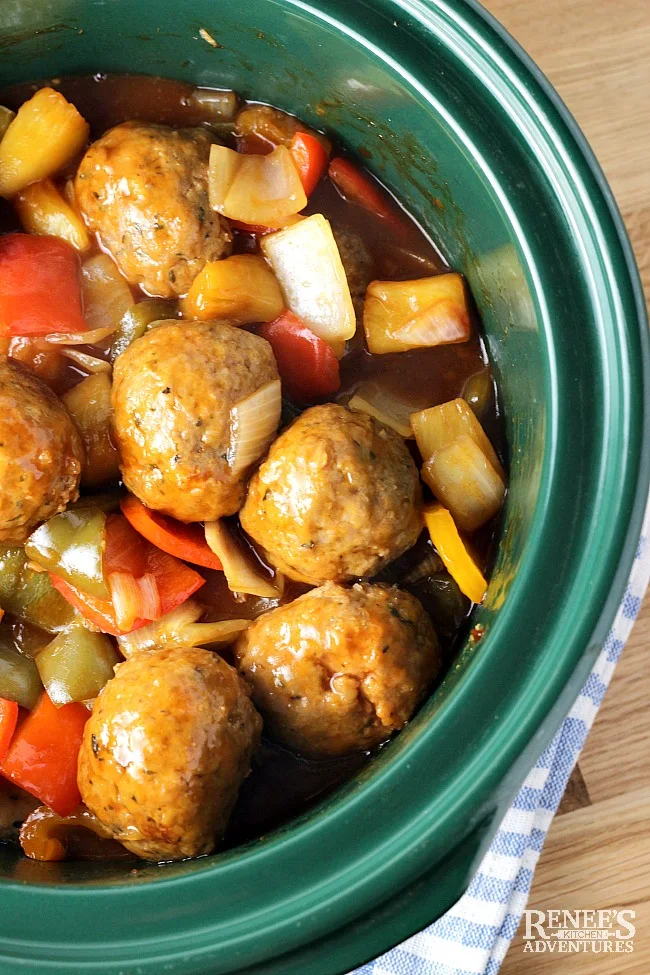 Sweet and Sour Ground Pork Meatballs by Renee's Kitchen Adventures overhead view of the dish in a crock pot ready to eat