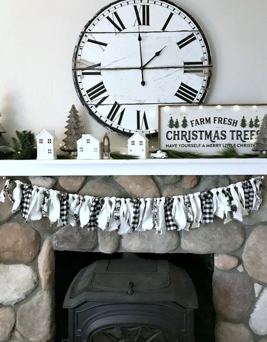 Black and white Christmas mantel with large clock