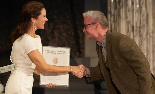 Crown Princess Mary wore a white dress by David Andersen, and Paris white leather pumps by Gianvito Rossi