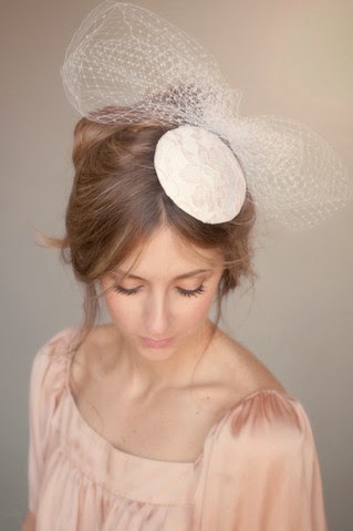 http://www.whitetrufflestudio.com/collections/headpieces-1/products/bridal-lace-and-birdcage-bow-headpiece-style-116