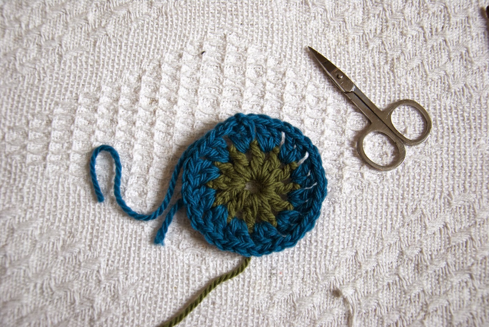 Crochet this classic granny square with a circle centre, using this free pattern.