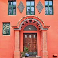 Orange Art Nouveau doorway in Alesund Norway
