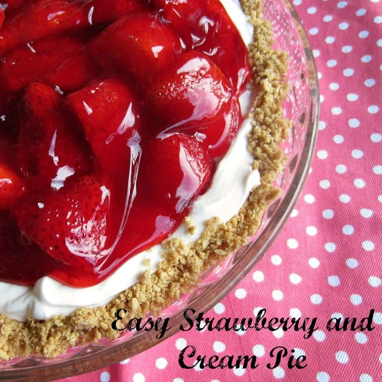 Easy Strawberry and Cream Pie by Renee's Kitchen Adventures overhead view of corner of whole pie in pie plate with pink polka dot background and text overlay 