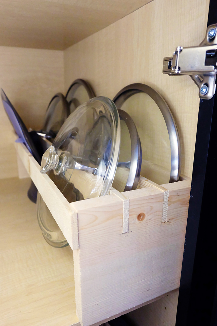 lid rack in cabinet with lids