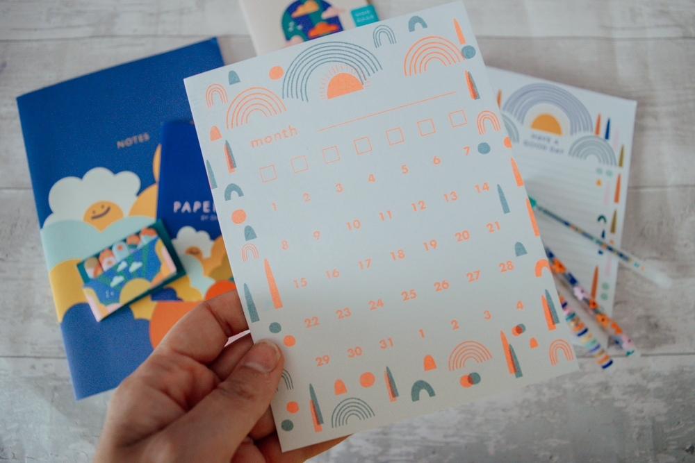 Blank calendar card being held up
