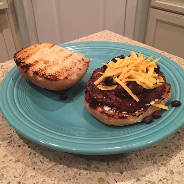 Mexican Taco Burgers topped with black beans, cheese, sour cream & guacamole.  Grill them on Big Green Egg (or grill of choice) Delicious! | The Lowcountry Lady