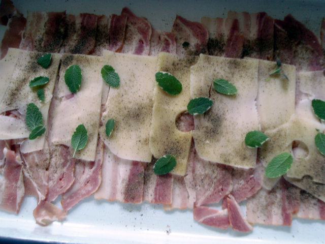 Arrange bacon slices crosswise in the baking pan