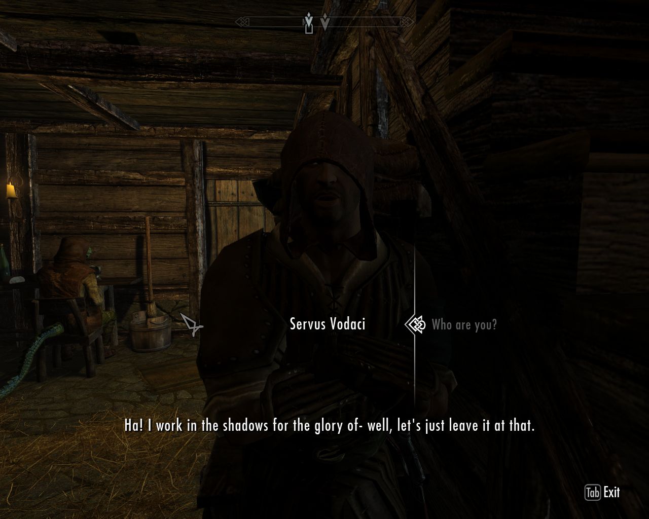 poorly lighted taproom with wooden walls, man with a hooded robe talks about himself to the protagonist