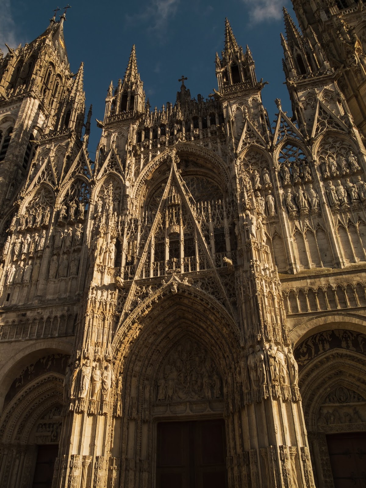 Sun shining on the front of the Cathedral in Rouen, France.