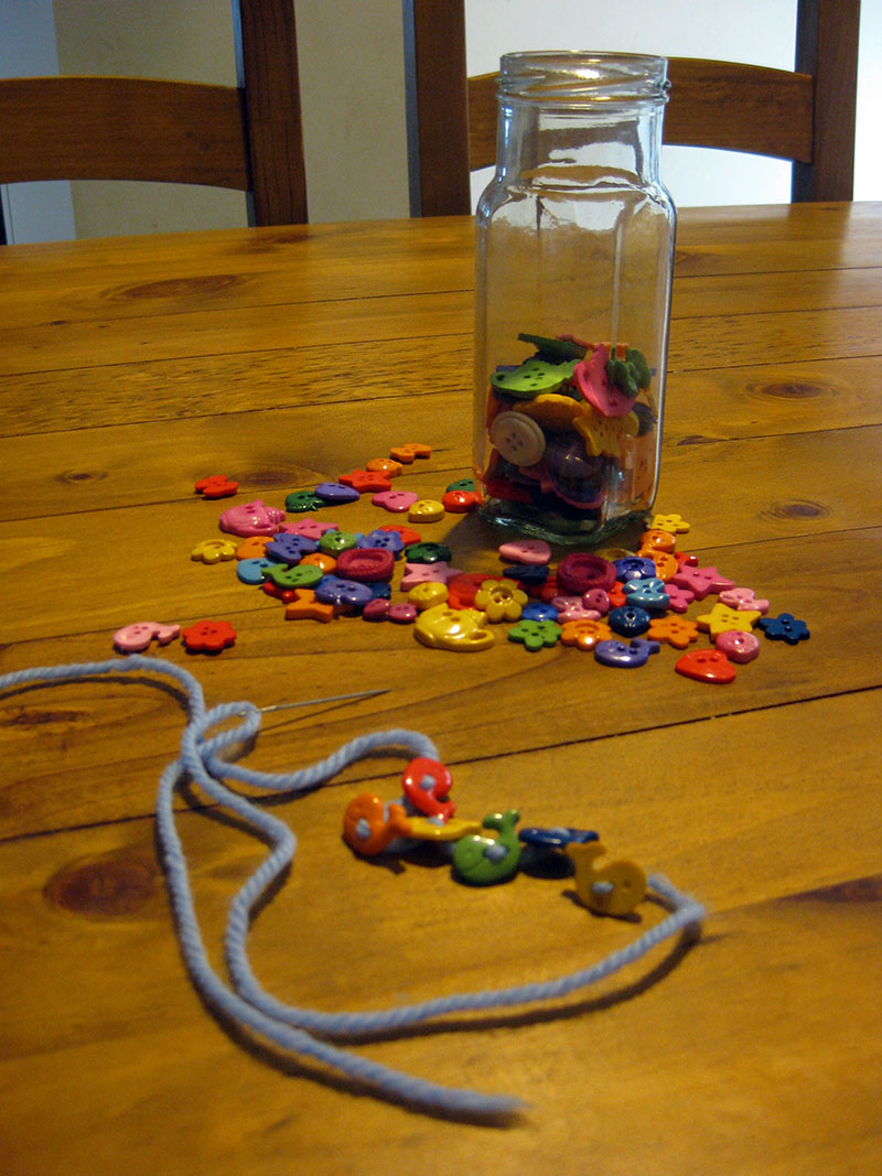 Threading buttons ~ Happy Whimsical Hearts