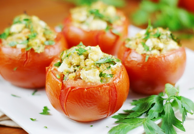 Baked with a flavorful feta cheese and fresh parsley filling, these Feta-Stuffed Tomatoes are sure to please.  Not to mention, they're a great way to eat up those oodles of garden tomatoes coming out your ears!   www.thekitchenismyplayground.com