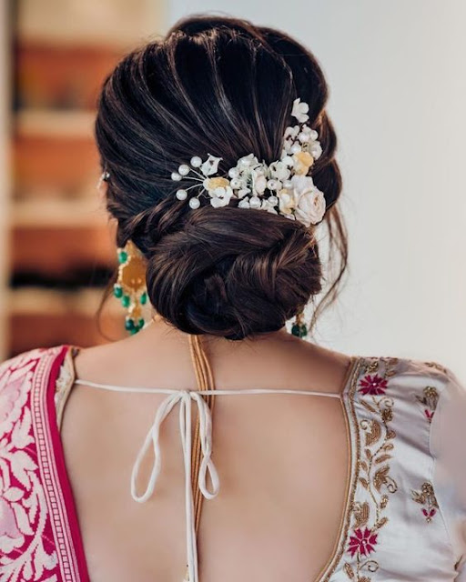 30+ Messy Bridal Bun Hairstyles with Flowers for Wedding - WallpaperDPs