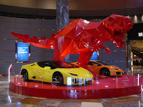 Lamborghinis and Tyrannosaurus sculpture display at City of Dreams Macau