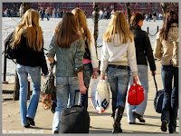 Girls in blue jeans on the street