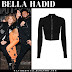 Bella Hadid in black zip crop top and orange pants in Toronto on November 5