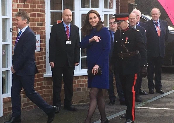 Kate Middleton wore Goat Ellory Bow Detail Coat. Duchess Catherine of Cambridge carried Beulah London Aspinal Blue Heart Clutch