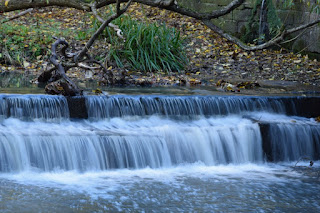 The Ouseburn river tumbling over rocks under the White Bridge