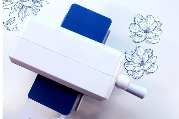 Use a die cutting machine to cut out flower stamp with matching die cut.