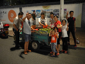 tangerines for sale in a motor-tricycle cart