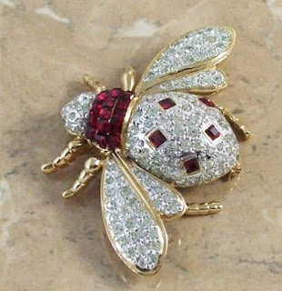 Vogue signature on a bee brooch