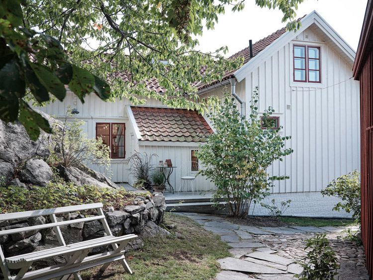 An Idyllic Blue and White Swedish Cottage In The Countryside