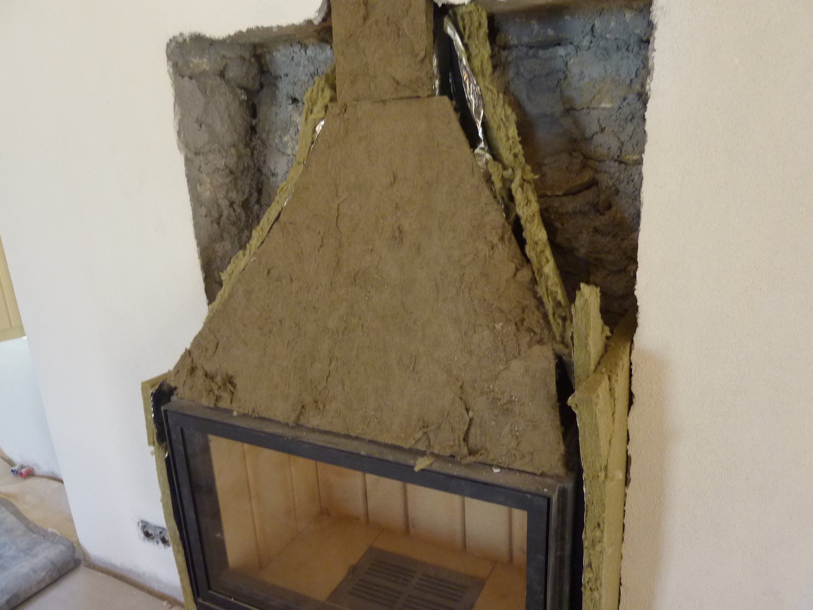 house in Proastio: fireplace in place with insulation all around