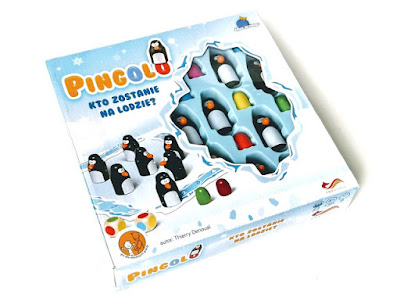 gry dla małych dzieci, na zdjęciu pudełko gry pingolo z wesołymi plastikowymi pingwinami prześwitującymi przez okienko w pudełku