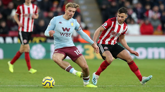 Aston Villa star Jack Grealish takes on a Sheffield United player during a premier league match