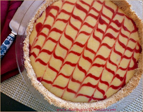 Berry Key Lime Pie in a Nut Crust, the classic Key Lime pie kicked up a notch with the addition of a berry swirl and served in a walnut crust | Recipe developed by www.BakingInATornado.com | #recipe #pie