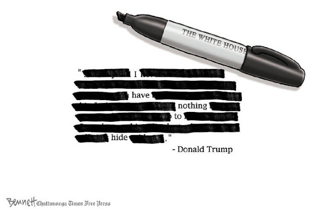 Image of sharpie labeled White House next to a document with multiple words marked out so that all that remains is 